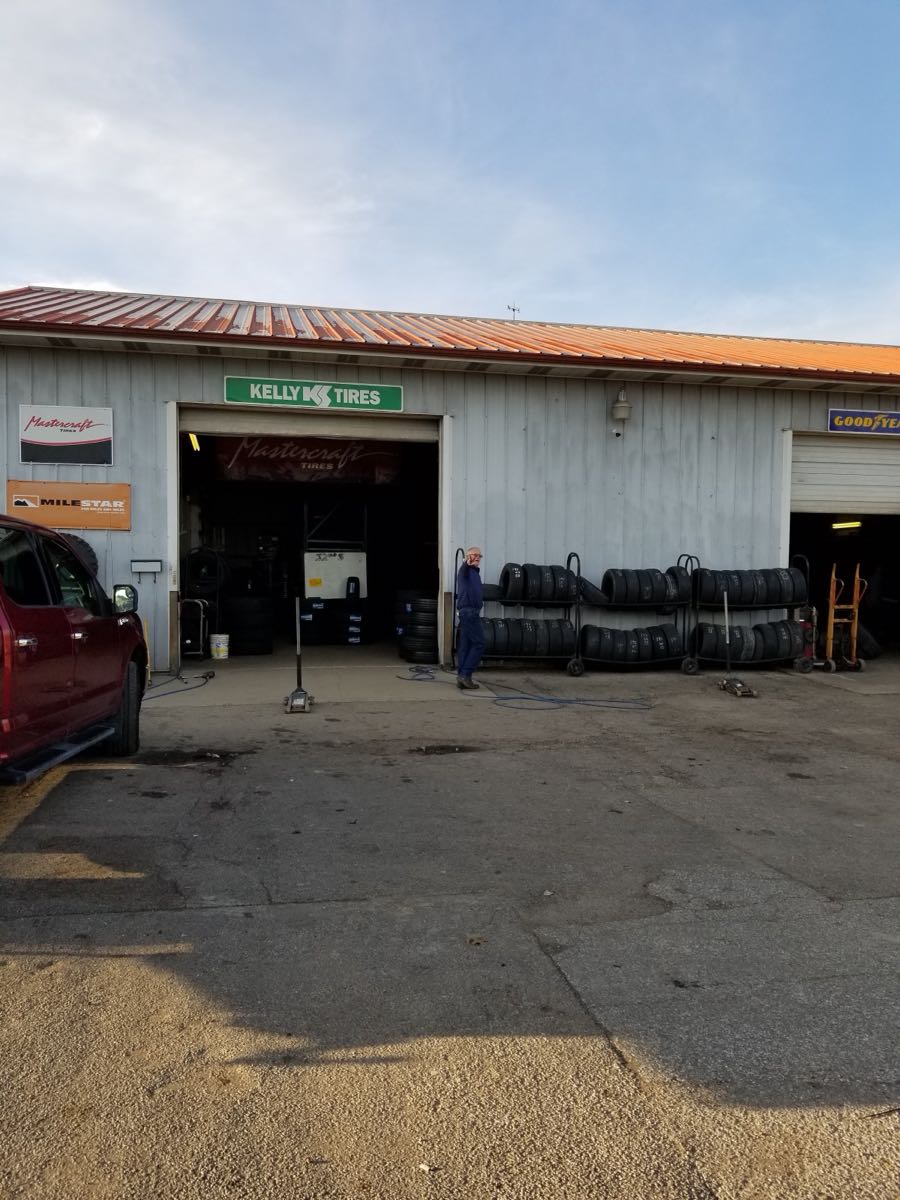 The 32nd Street New and Used Tire shop building in Ashland, KY, with open service bays and tires on racks